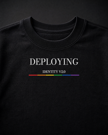 FÆBRIQ Deploying Identity v2.0 Heavyweight Crewneck — macro view showing the white print and six-stripe Pride Circuit bar.