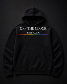 FÆBRIQ Off The Clock. Still Iconic. Heavyweight Hoodie — studio front view showing the white print and six-stripe Pride Circuit bar.