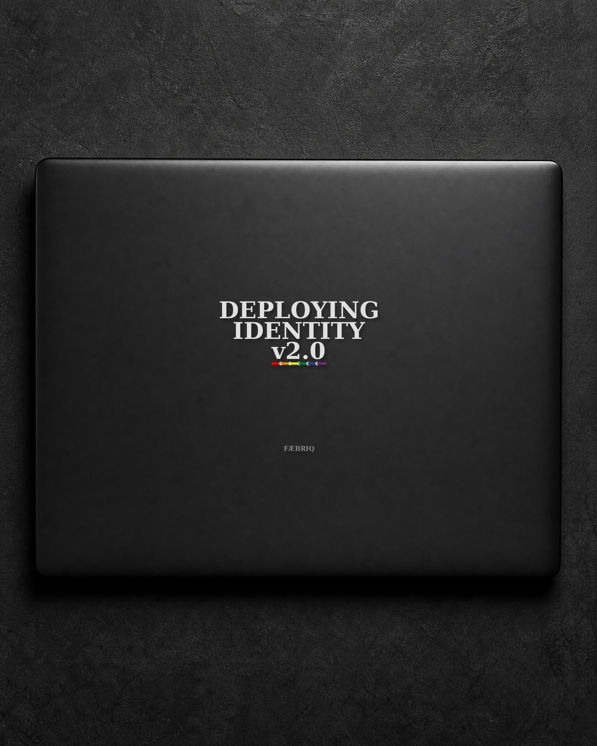 Deploying Identity v2.0 sticker centered on a black laptop lid.