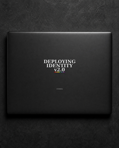 Deploying Identity v2.0 sticker centered on a black laptop lid.