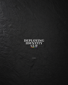 Close view of a Deploying Identity v2.0 sticker on a dark textured surface.