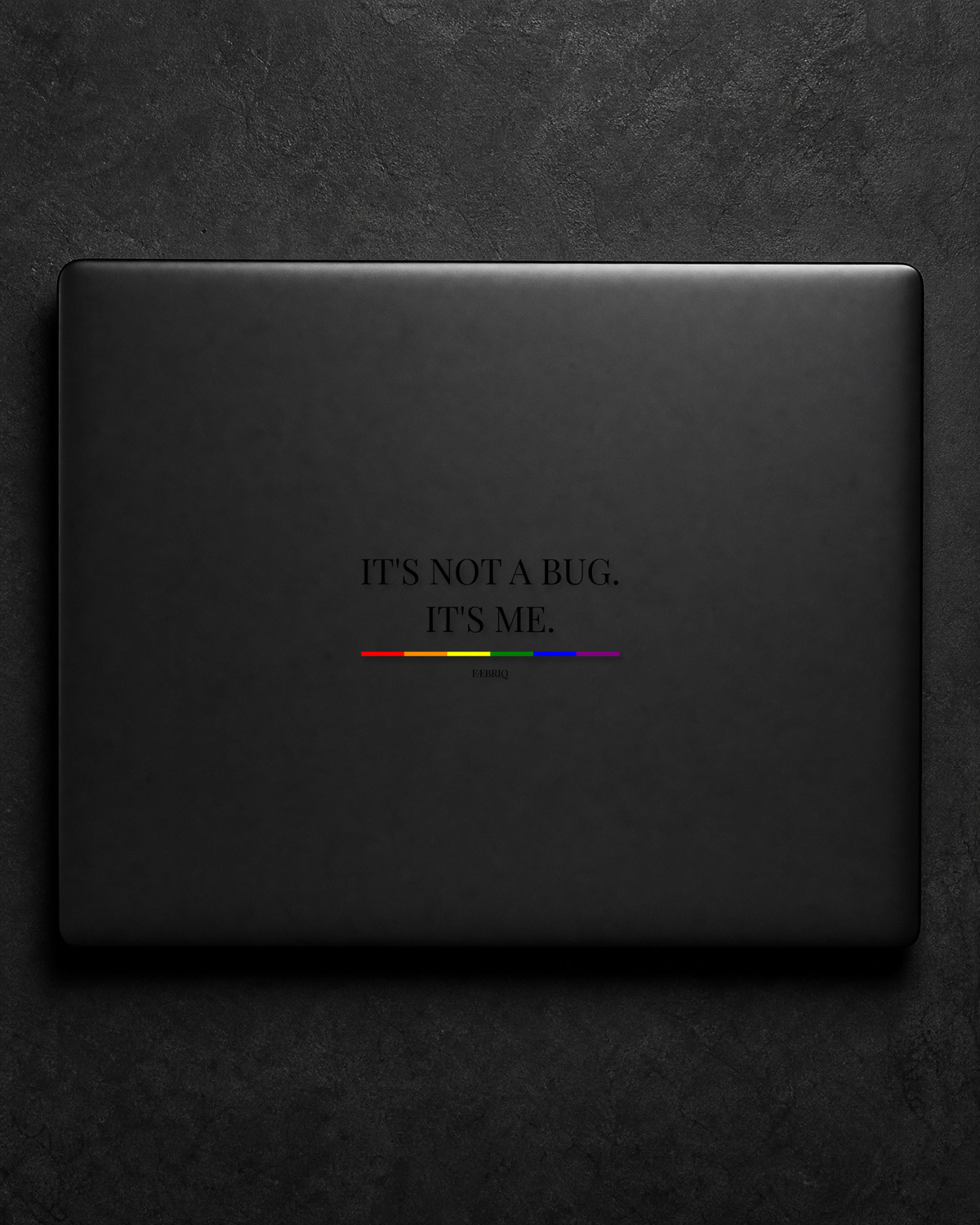 It's Not A Bug. It's Me. sticker centered on a black laptop lid.