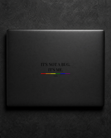 It's Not A Bug. It's Me. sticker centered on a black laptop lid.