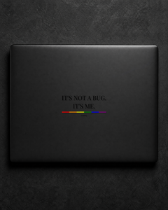 It's Not A Bug. It's Me. sticker centered on a black laptop lid.