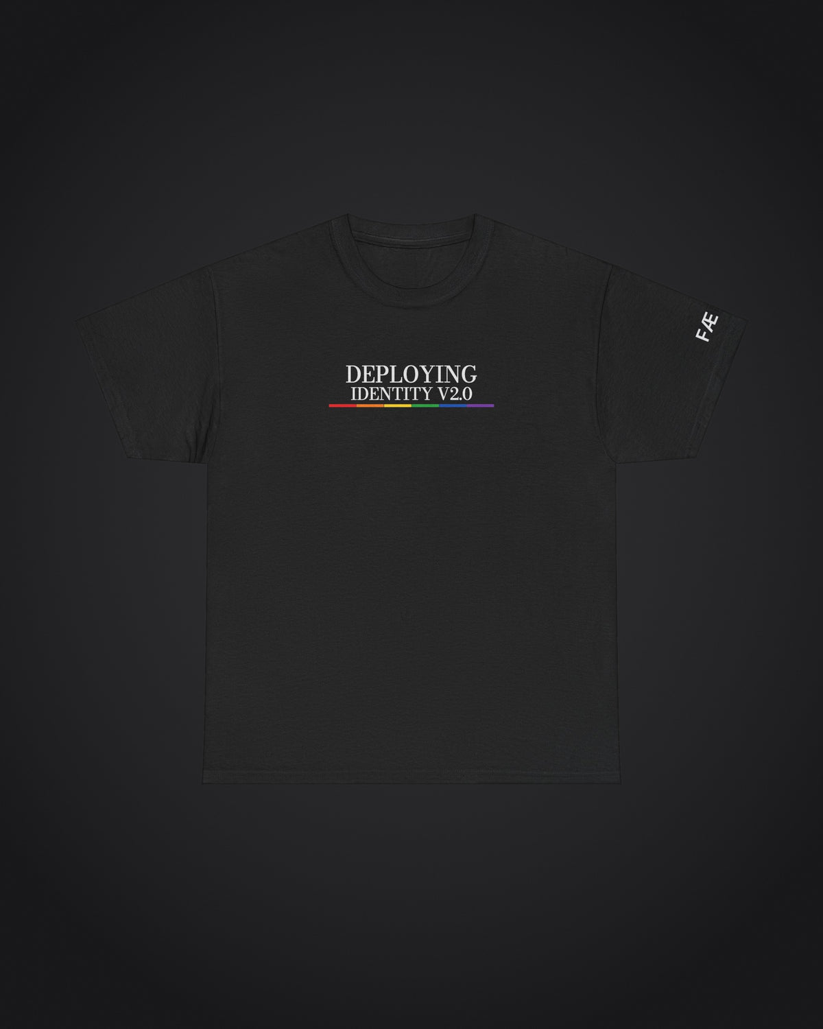 FÆBRIQ 'Deploying Identity v2.0' Tee: black tee with the white Deploying Identity v2.0 print over the six-color pride-circuit bar, on a charcoal studio backdrop.