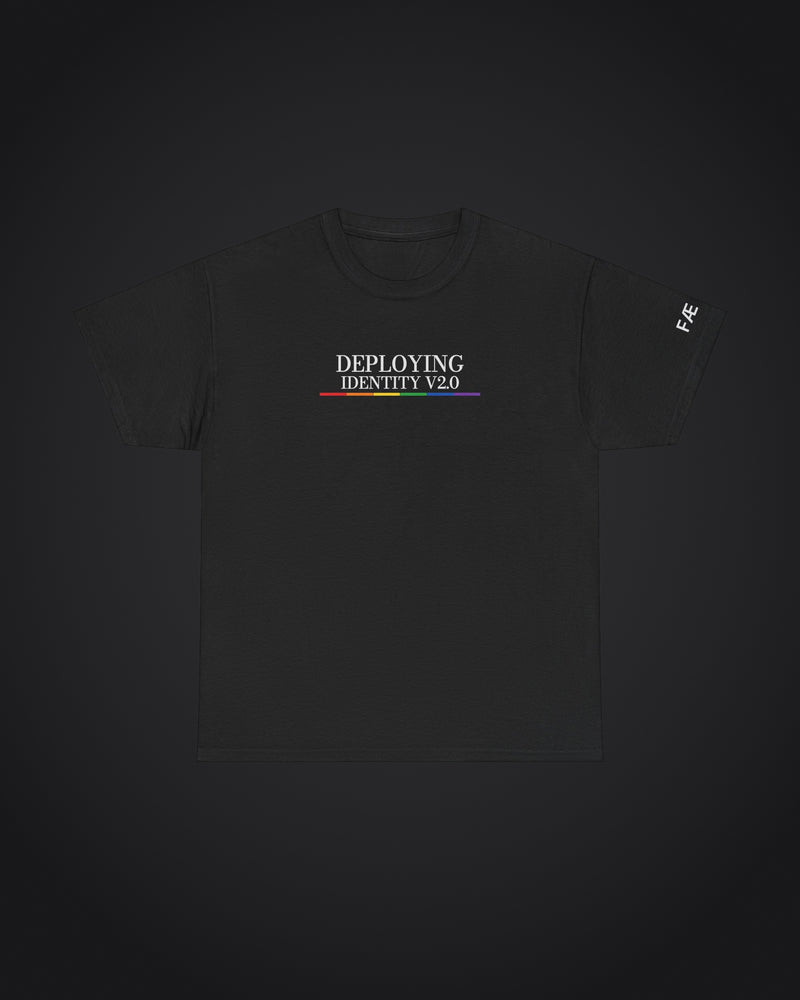 FÆBRIQ 'Deploying Identity v2.0' Tee: black tee with the white Deploying Identity v2.0 print over the six-color pride-circuit bar, on a charcoal studio backdrop.